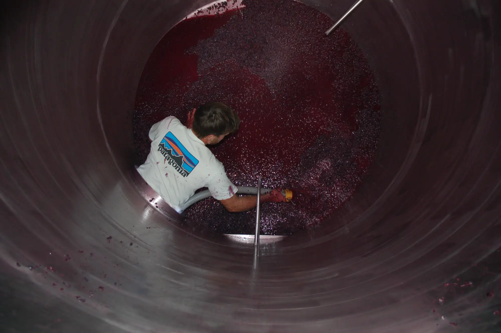 Man in the large wine tank
